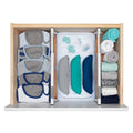 Two white adjustable dividers organizing items inside a drawer