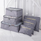 Complete grey six-piece packing cube set with three cubes and three pouches