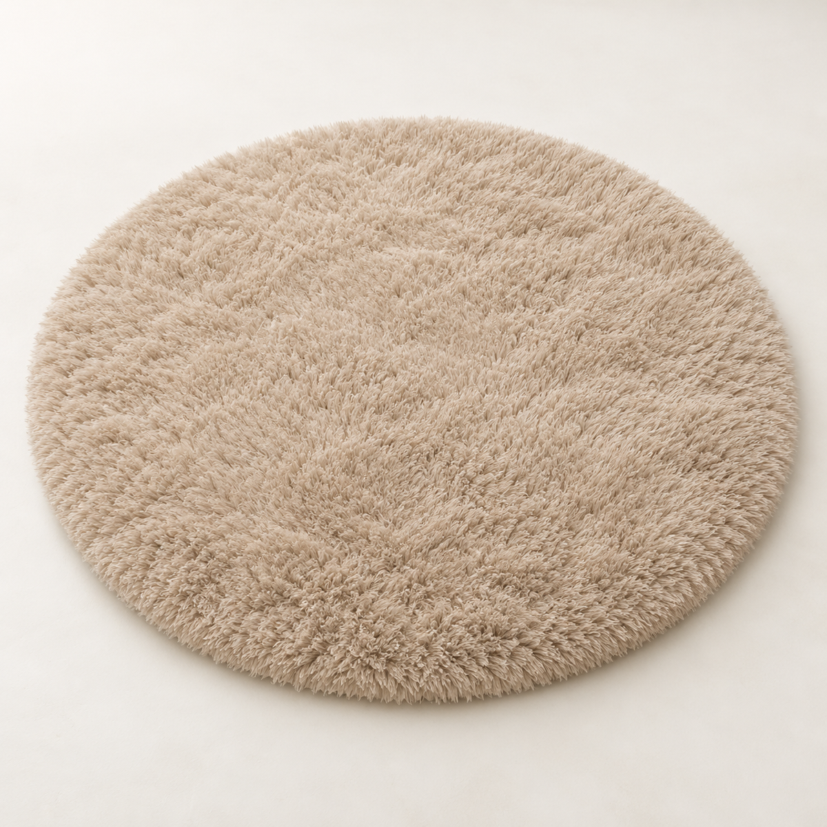Khaki round plush area rug shown alone on a light background.