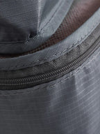Close view of grey packing cube zipper, stitching and fabric