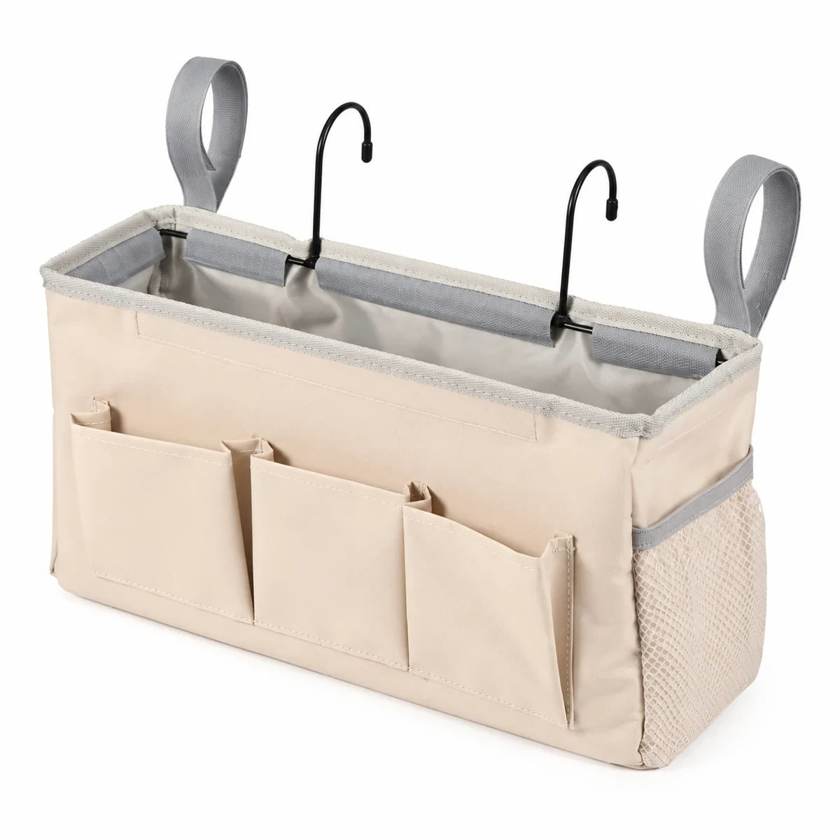 Beige bedside caddy organizer with three front pockets, side mesh pocket, loops and metal hooks