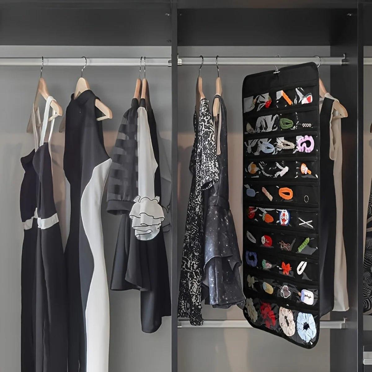 Black hanging jewelry organizer used inside a closet