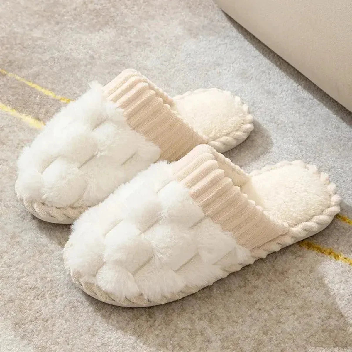 Pair of white woven plush indoor slippers