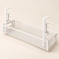 White perforated metal under-desk cable tray with two screw clamps and open basket