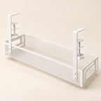 White perforated metal under-desk cable tray with two screw clamps and open basket
