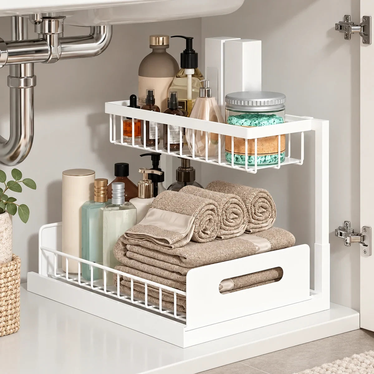 White two-tier under-sink organizer styled inside a bathroom cabinet