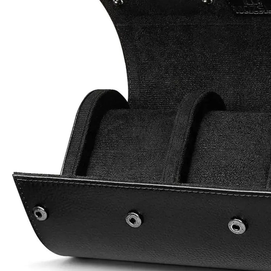 Close view of black leather, soft lining and snap closures