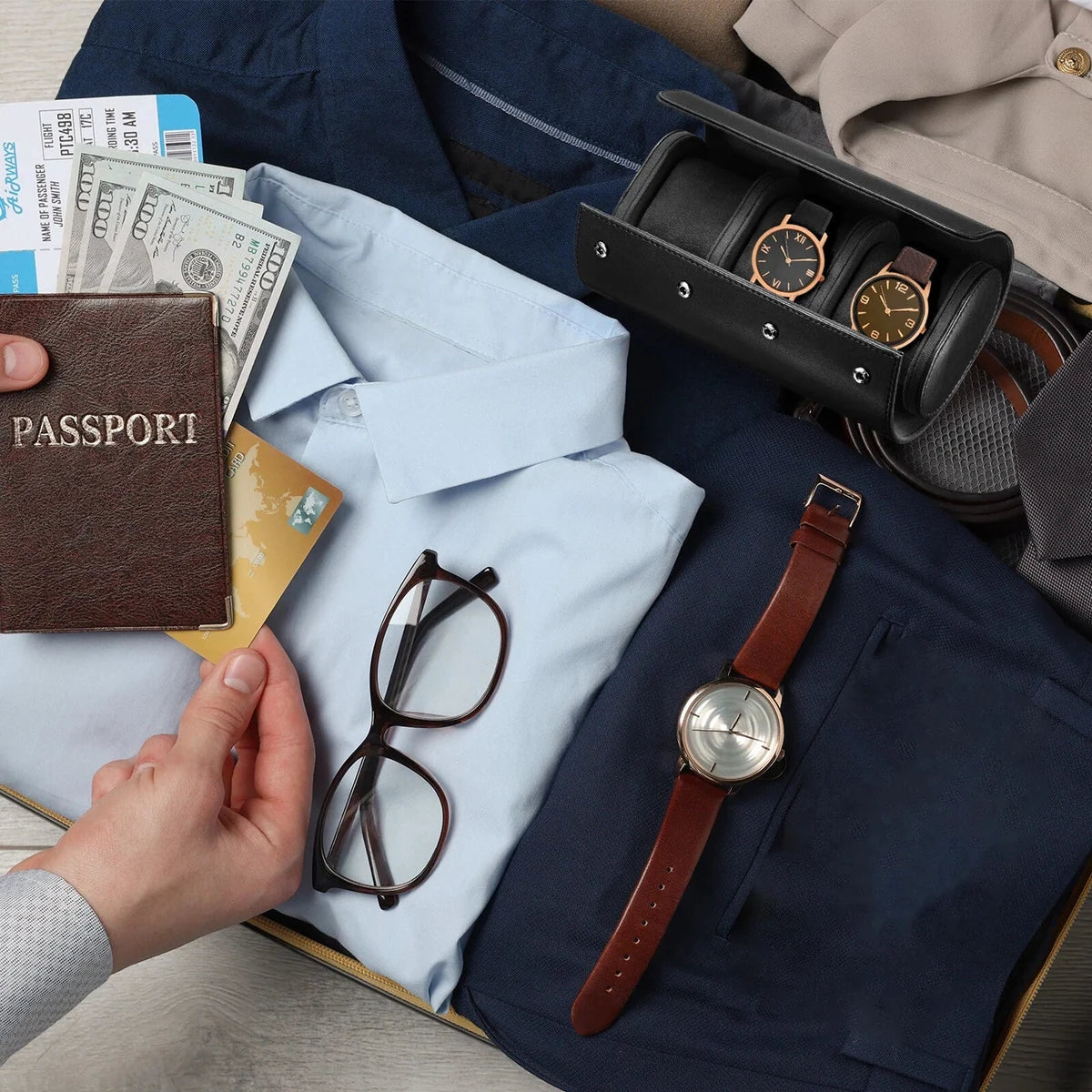Black three-slot watch travel roll open inside packed luggage