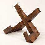 Dark stained interlocking wooden cookbook stand with X-frame and front ledge