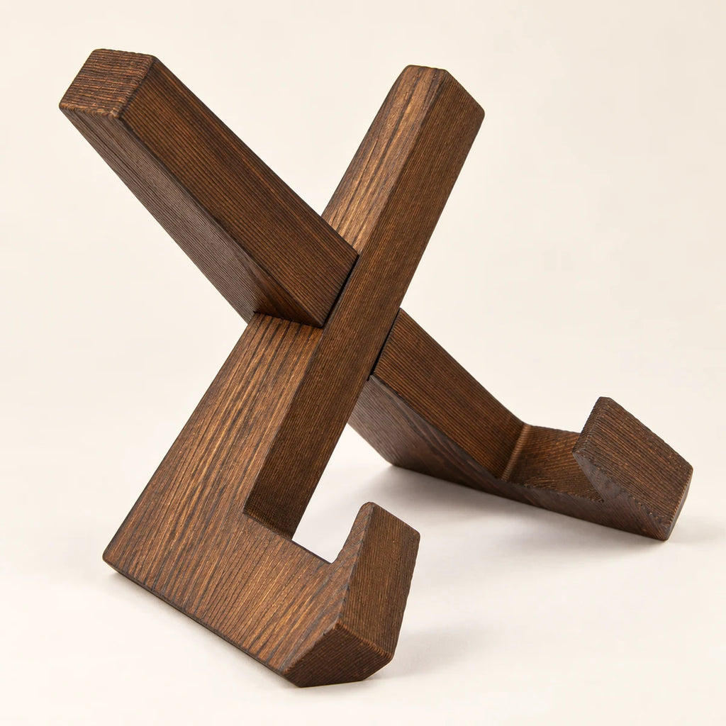 Dark wooden cookbook stand shown from an alternate angle with its interlocking construction