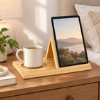 Natural wood reading stand holding a tablet with a cup in the recessed holder