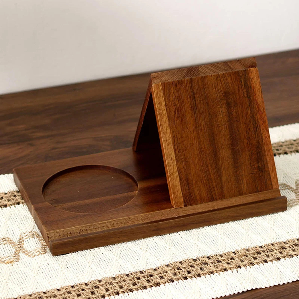 Walnut brown reading stand with rectangular base, circular cup recess and A-frame panel
