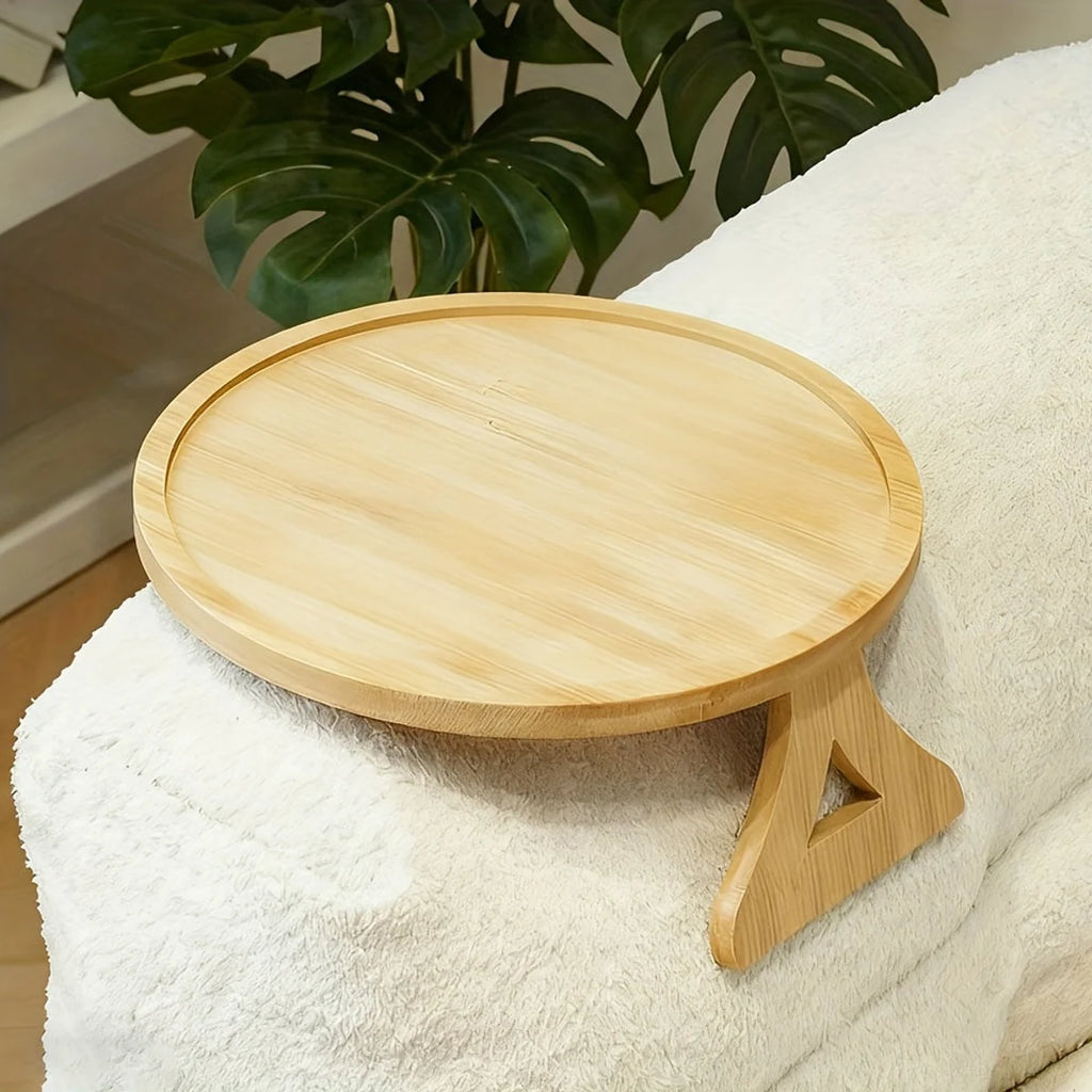 Round wooden sofa arm tray on a light couch