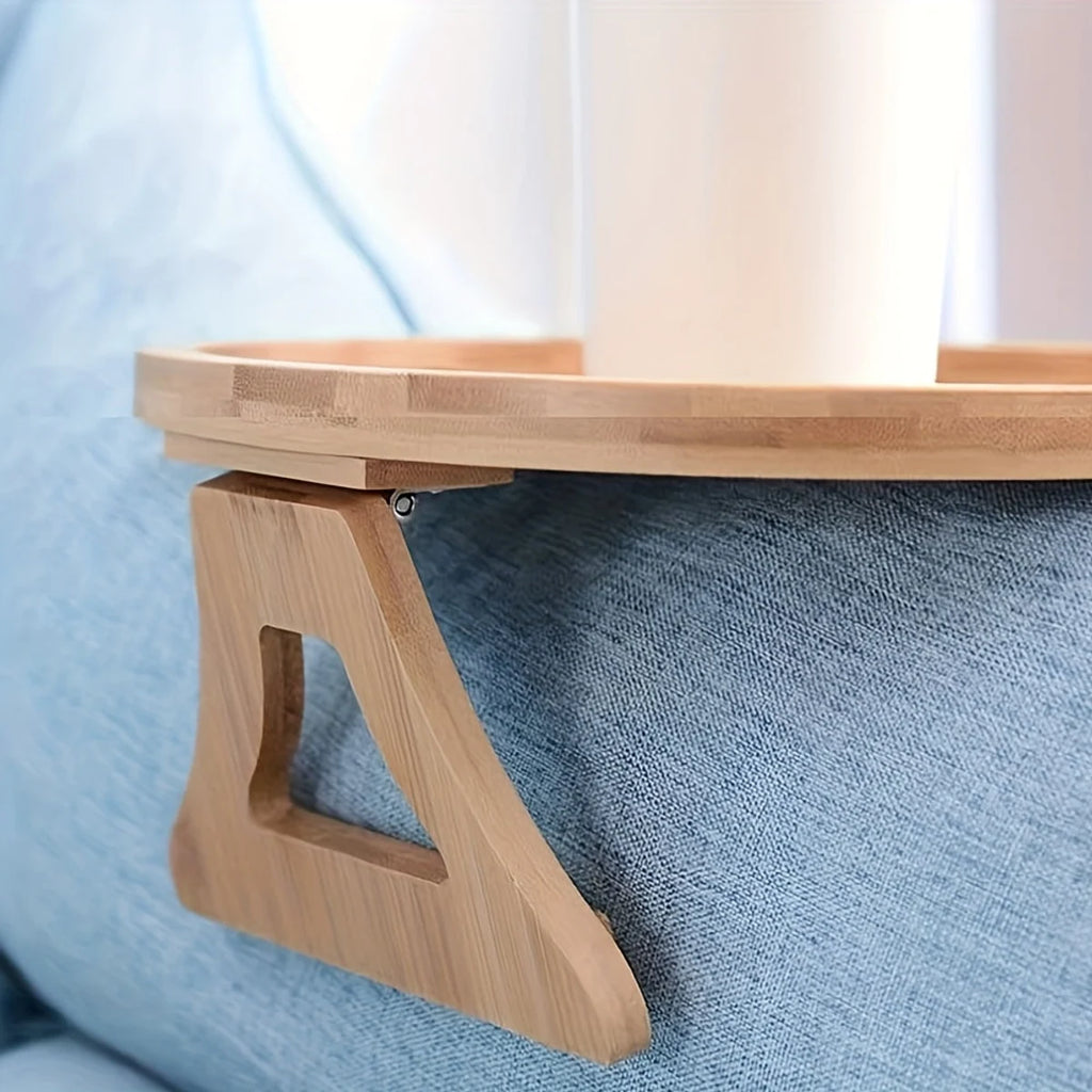 Close-up of the folding support on the round wooden sofa arm tray